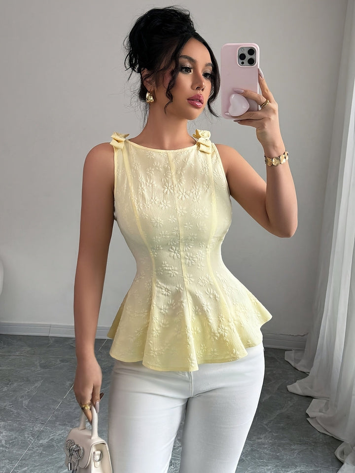 Ärmelloses, ausgestelltes Damen-Top mit Rundhalsausschnitt – Bluse mit floraler Schleife